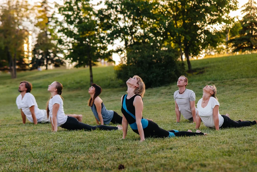 group-people-doing-yoga-park